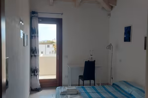 Camera con bagno esclusivo e uso cucina