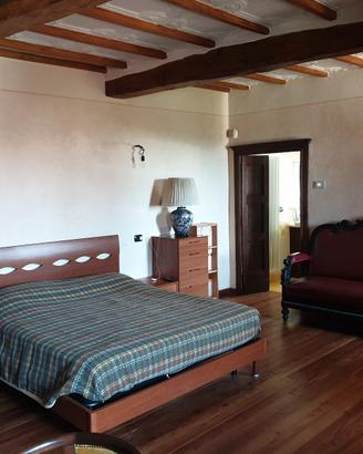 Ampia camera da letto con uso cucina