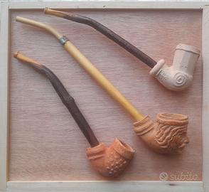 Tre pipe artigianali in terracotta
