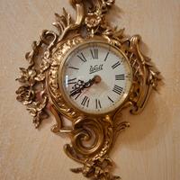 orologio da parete dorato 