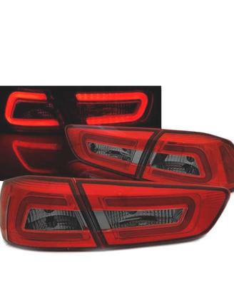 FANALI MITSUBISHI LANCER 8 SEDAN 08-11 BAR LED ROS