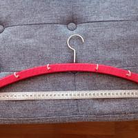 Gruccia per appendere le cinture 