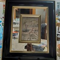 Quadro con bassorilievo centrale argentato firmato