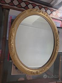 Specchio ovale legno dipinto oro.