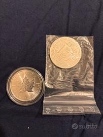 tre monete in argento da 1 oncia