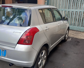 Suzuki Swift con mezzo da lavoro