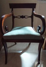 poltrona con braccioli a riccioli 