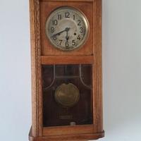 Orologio a pendolo da  parete. Anni 60.