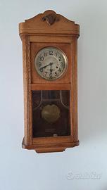 Orologio a pendolo da  parete. Anni 60.