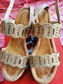 Sandali a zeppa dorati Patrizia Azzi con cinturino