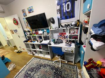 cameretta con divano letto e cabina armadio scriva