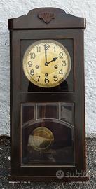 Orologio a parete con pendolo