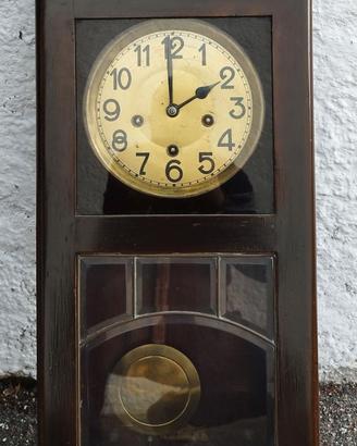 Orologio a parete con pendolo