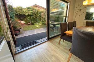 Postal casa a schiera con giardino privato