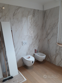 Rivestimenti murari con lastre effetto marmo