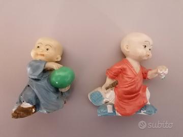 Statuine orientali, coppia di bambini che giocano