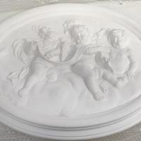 OVALE IN GESSO CON PUTTI