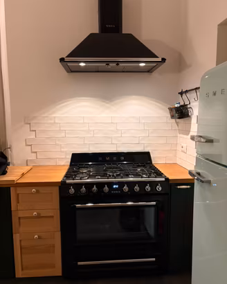 Smeg, cucina con forno e cappa 90 cm