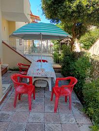 Casa con giardino