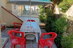 Casa con giardino