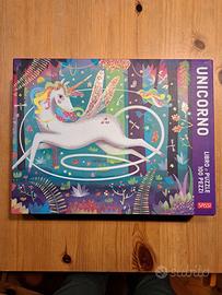 Unicorno libro e puzzle
