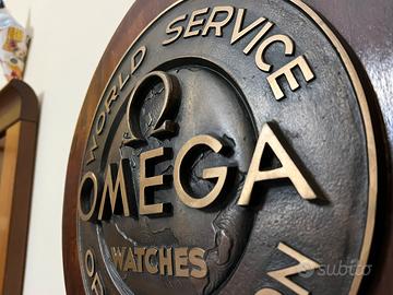 Scudo OMEGA, epoca 60/70’ in Bronzo