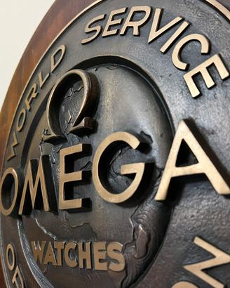 Scudo OMEGA, epoca 60/70’ in Bronzo