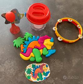 Puzzle dinosauro, tamburello, clacson per bici