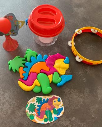 Puzzle dinosauro, tamburello, clacson per bici