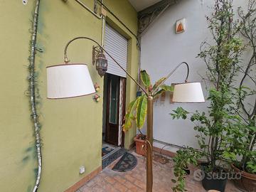 Lampada piantana a doppia luce