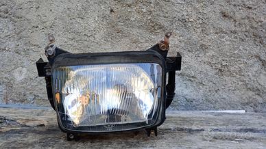 faro anteriore Dominator 