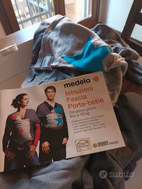 Fascia porta-bebè + scaldino elettrico