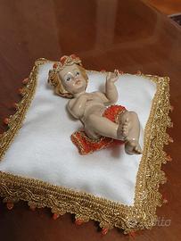 Bambinello artigianale prezioso con corallo 