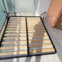 Rete per letto contenitore a compasso