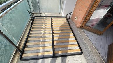 Rete per letto contenitore a compasso