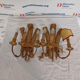 Coppia di applique in legno dorato