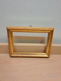 Cornice in legno color oro