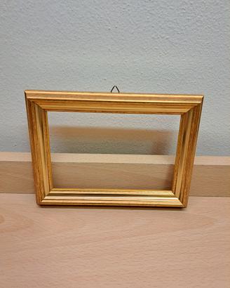 Cornice in legno color oro