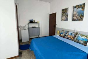Stanza singola con bagno privato e balcone