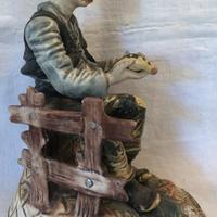 Statuetta ceramica uomo con uccellino