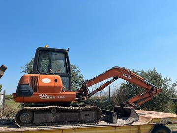 Fai-Komatsu 250 Mini Trax con varie attrezzature