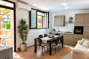 Trilocale con patio e giardino