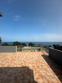 Attico vista mare con posto auto privato