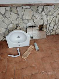 Lavabo sospeso con lampada e specchio