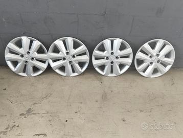 DACIA 4 calotte copricerchi + vasca baule