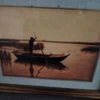 Pescatore sul lago al tramonto