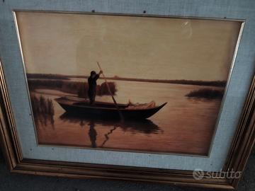 Pescatore sul lago al tramonto