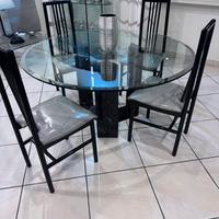 Tavolo rotondo in marmo con piano in cristallo