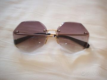 occhiali da sole con  lenti sagomate