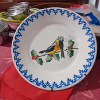 tre piatti mondovi antichi con decorazione uccelli